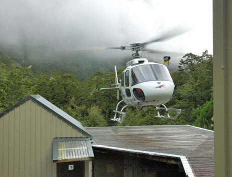 Helicopter landing at a DOC hut